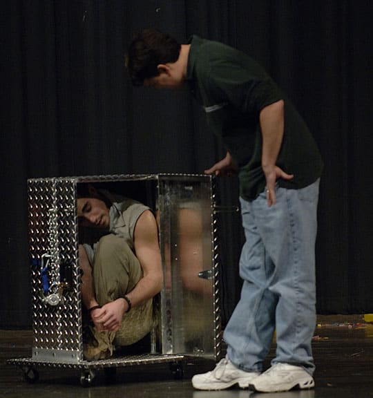 rudo in box with volunteer